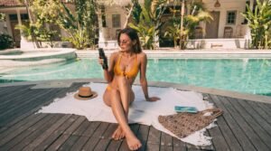 naturally tanned woman relaxing in sunlight representing tanning sprays and tanning routines