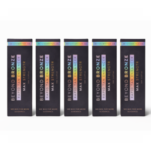 Five black boxes of Beyond Bronze Rapid Tan Enhancer.